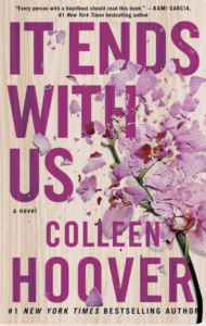 Book cover of It Ends With Us by Colleen Hoover. A smashed pink lily lays in pieces on a table. 